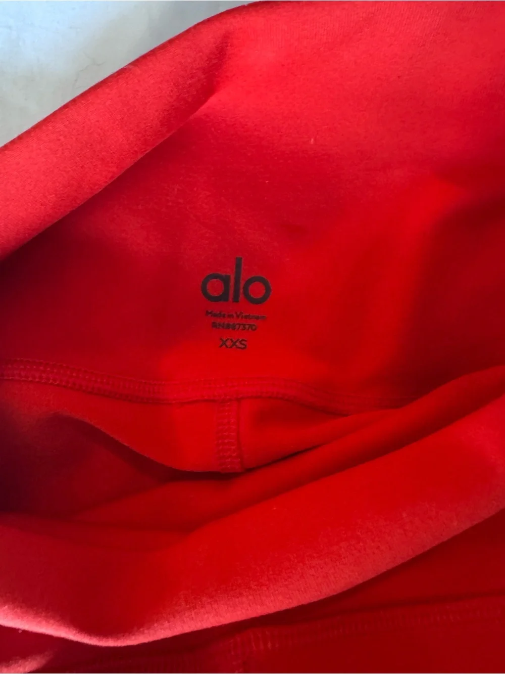 Like new Alo Yoga airbrush moto legging cherry size xxs